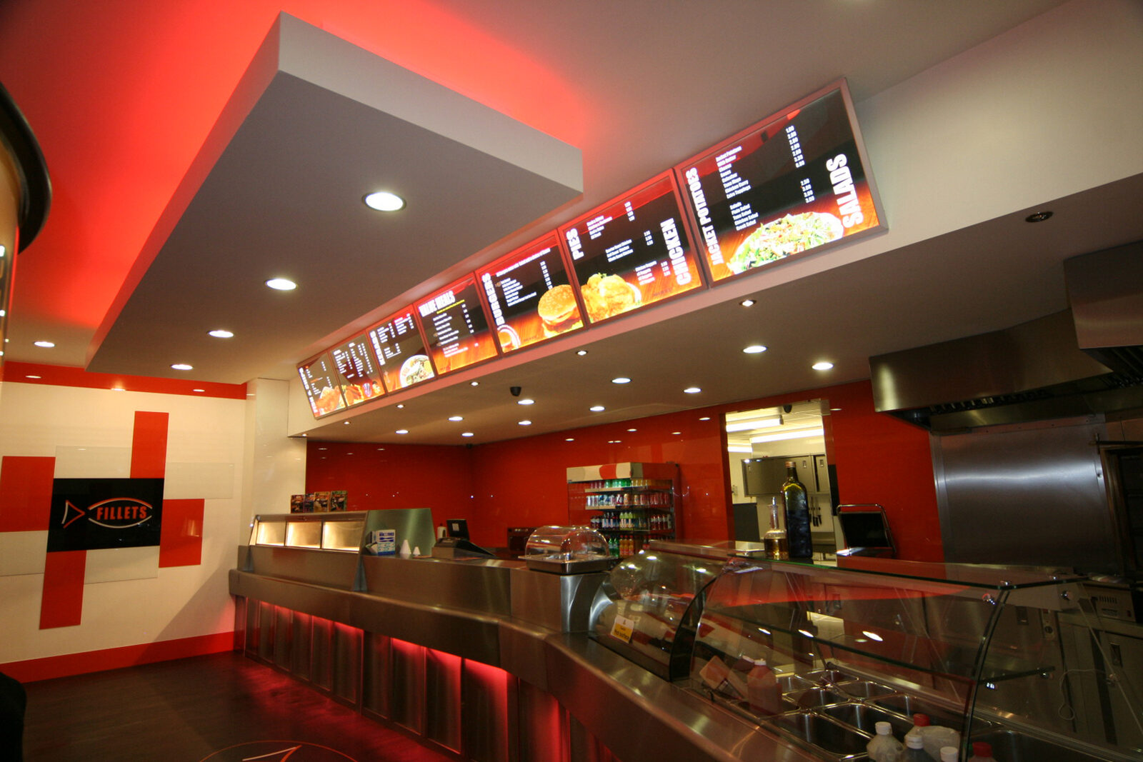 Red illuminated menu box run above the counter at Fillets, Peterborough