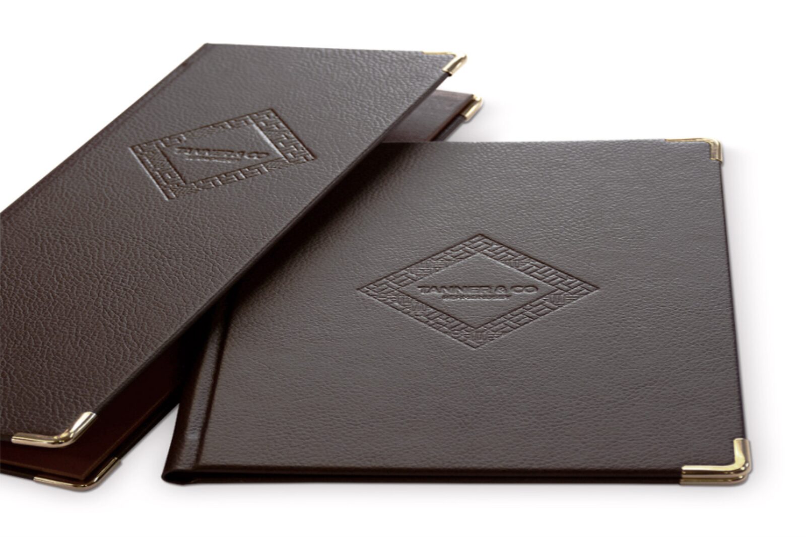 Leather menu book with the restaurant name blocked into the cover