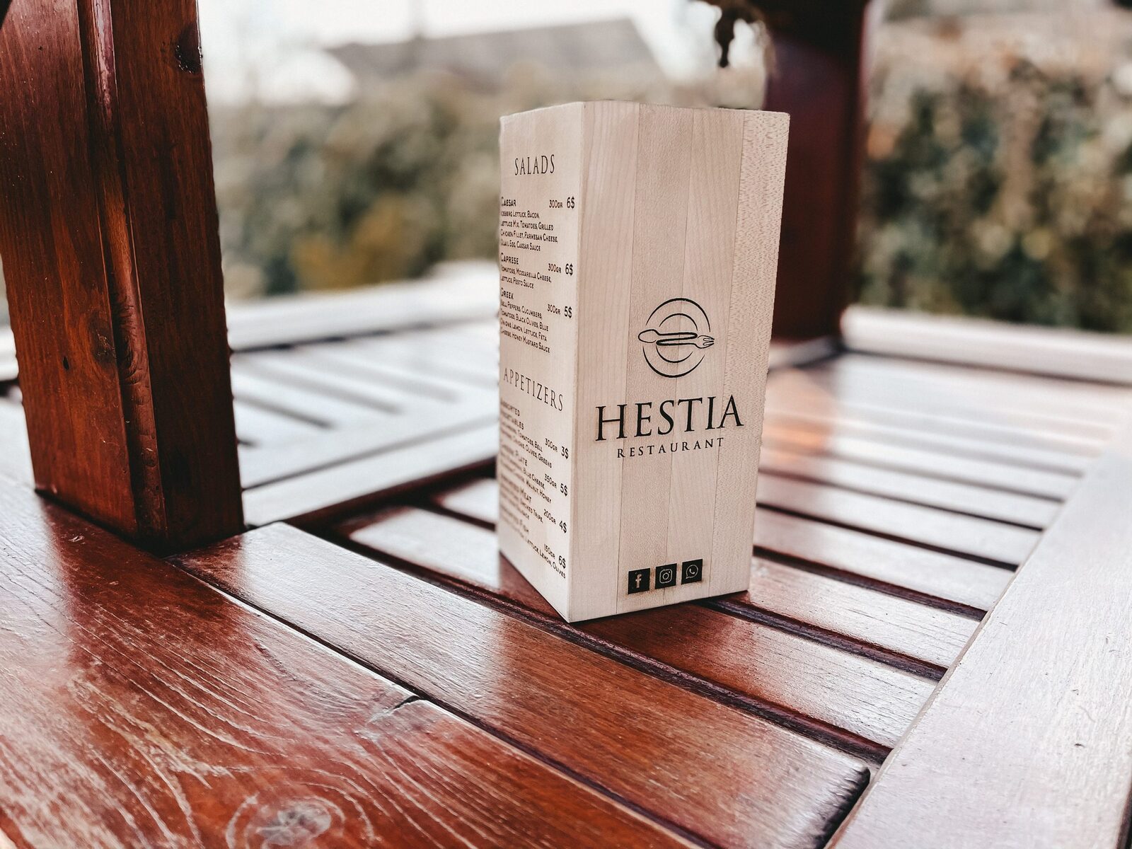 Printed table menu in a holder on an outdoor restaurant table