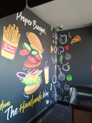 Burger bar wall graphics printed onto a dark interior wall