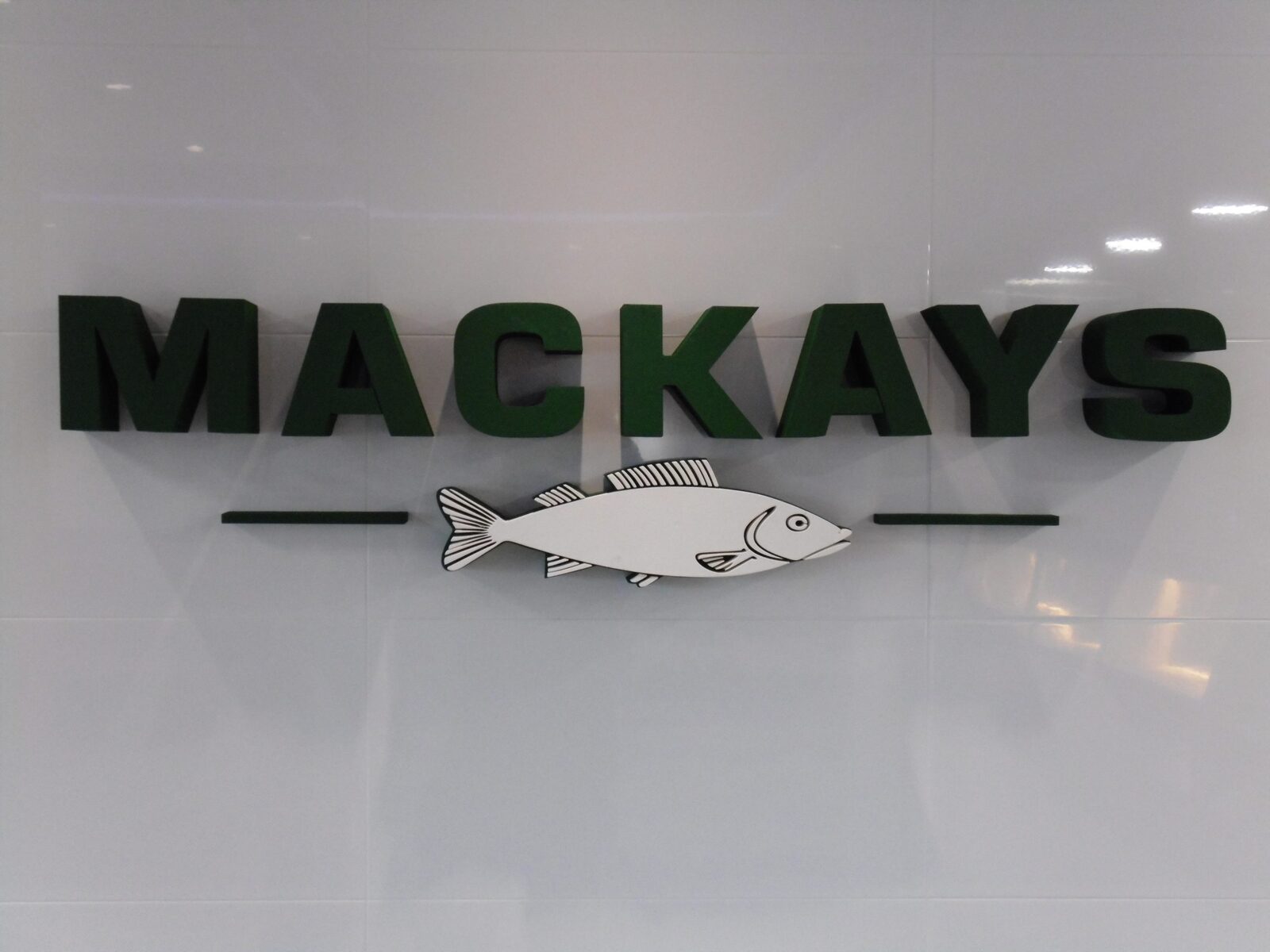 Mackays built-up letters with fret-cut fish detail