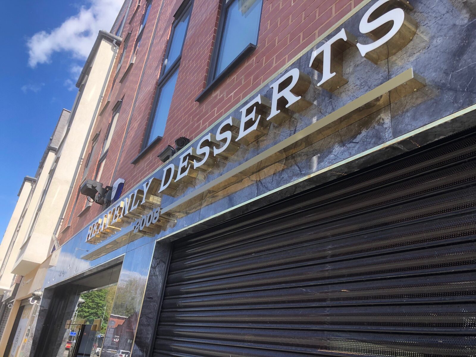 Heavenly Desserts built-up letters on brickwork
