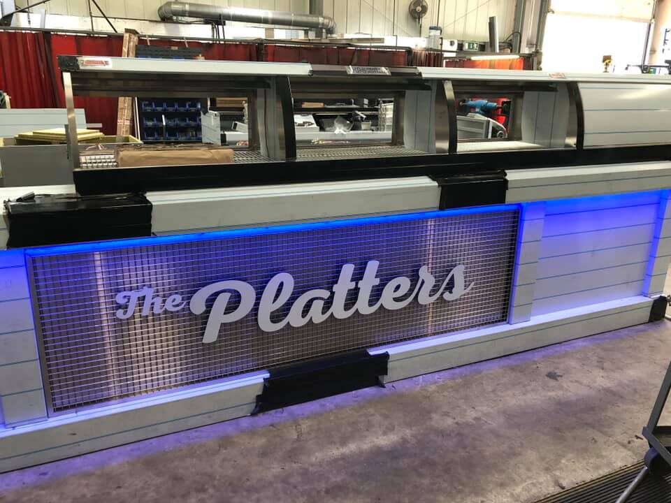 The Platters illuminated counter branding