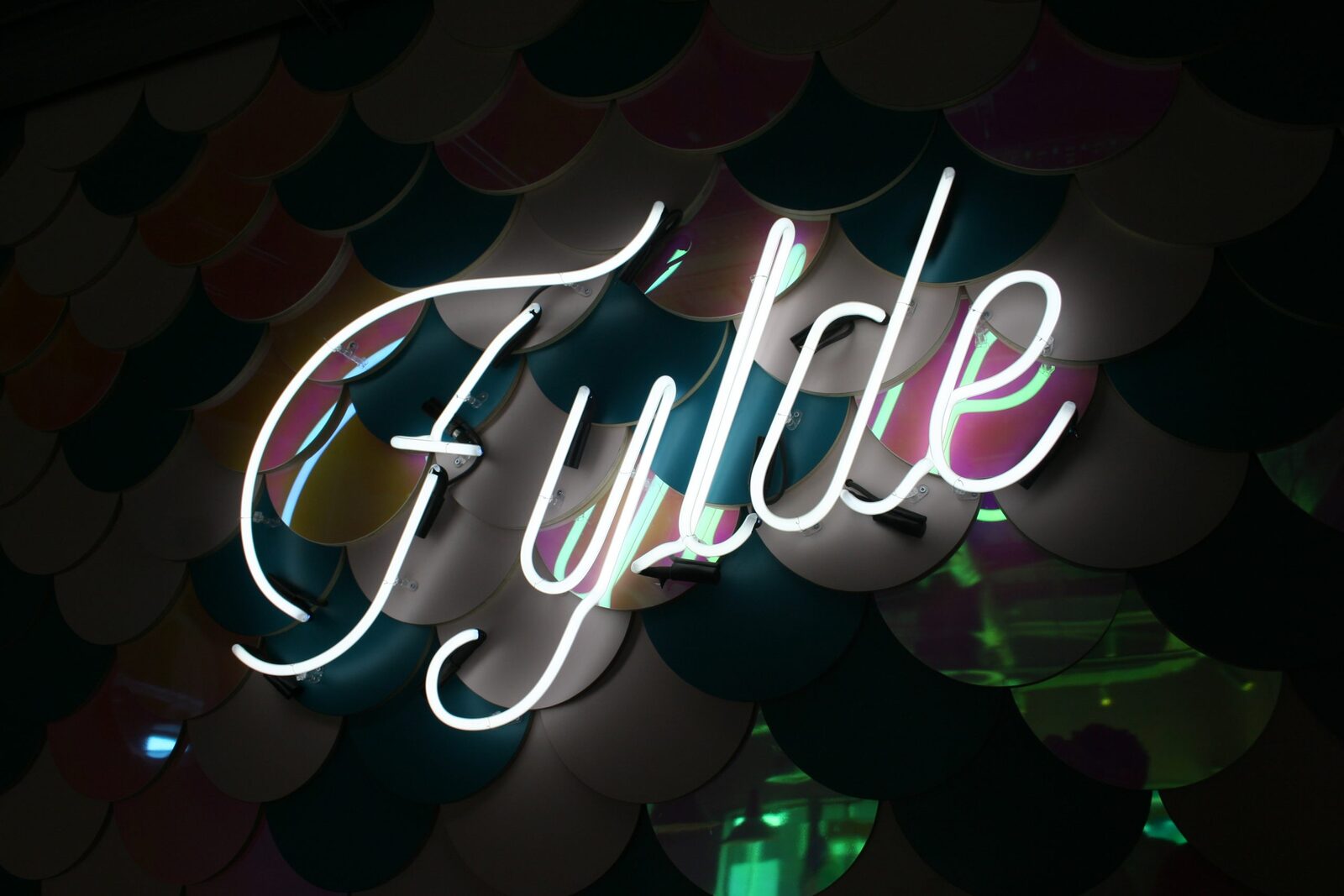 Fylde LED neon script sign on scalloped tiling