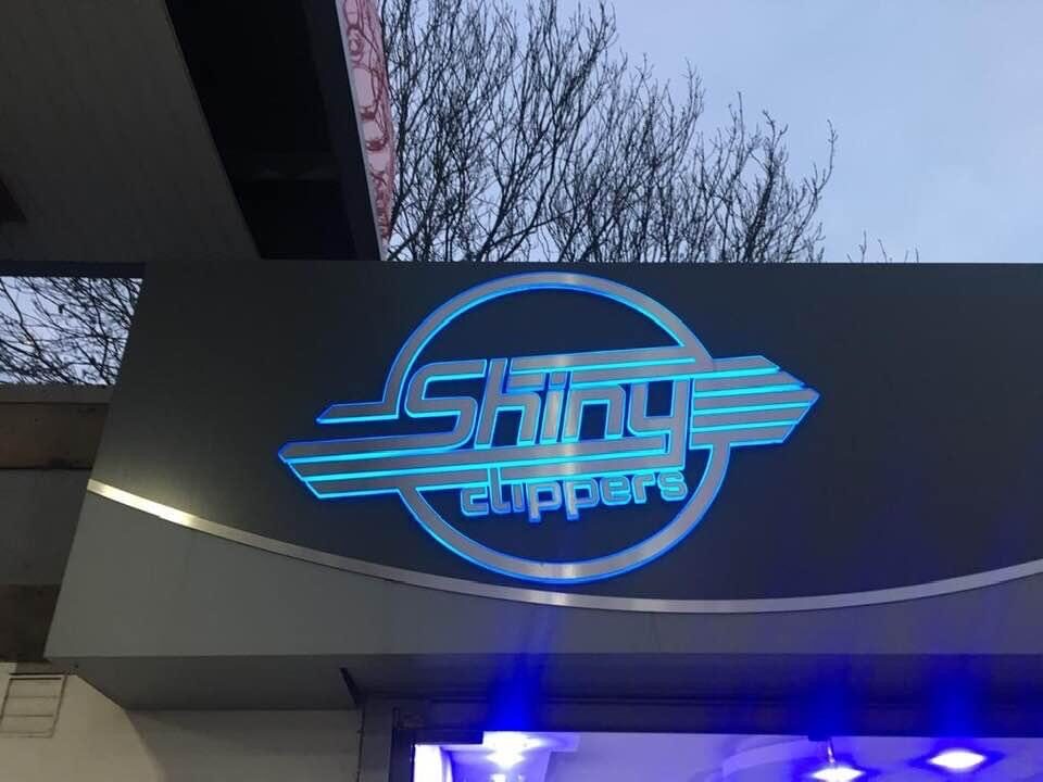Shiny Cutters push-through illuminated fascia sign