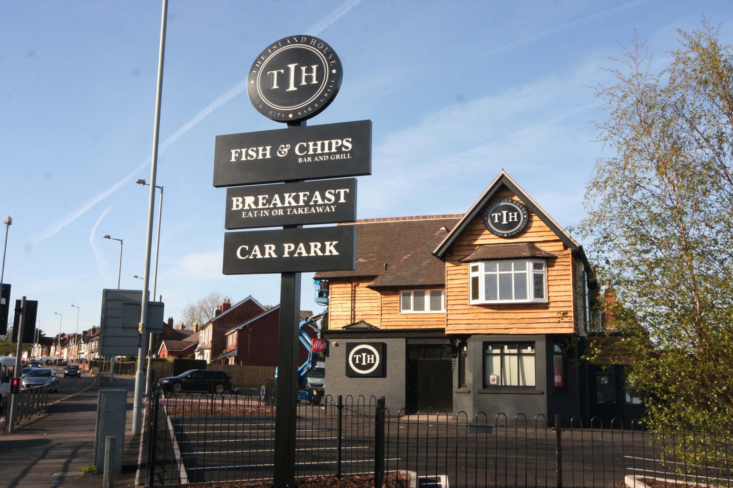 The Island House — Post-mounted totem & fascia